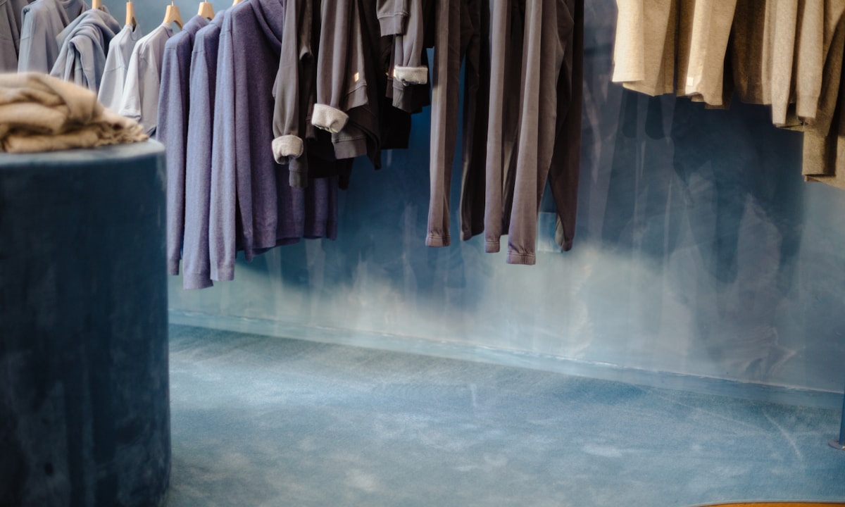 Clothing hanging on racks in a retail store